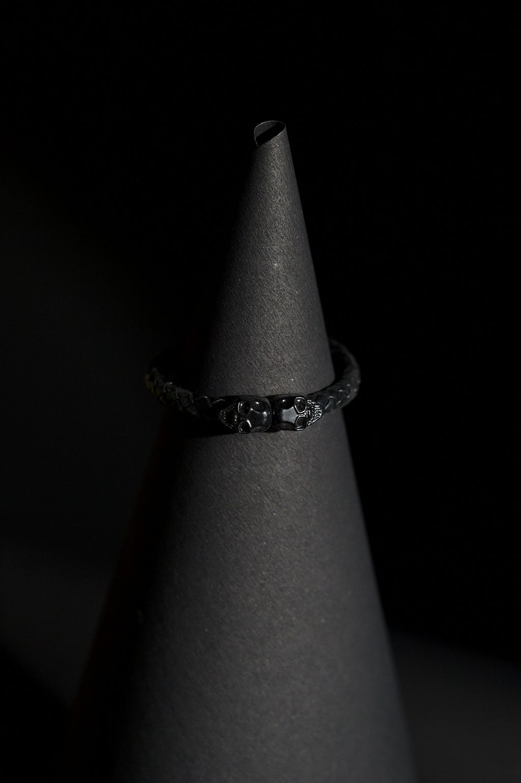 Bracelet | Single Strand | Woven Braided Cord | Black Braided Leather-Look Cord with Dual Black Skull Clasp-Accent | Men & Women | Braided Design | Matte Black Finish | Gothic & Edgy Style