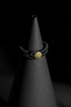 Bracelet | Single Strand | Woven Paracord | Black Knotted Cord | Engraved Disc Accent | Men & Women | Woven Design | Textured Fabric & Gold-Tone Finish | Casual & Nautical Style