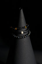 Bracelet Set | 3-Piece Stack | Beaded & Braided | Matte Black Beads, Lava Stone, Braided Leather & Speckled Obsidian Beads | Men & Women | Layered Design | Matte & Textured Finish | Minimalist & Earthy Style